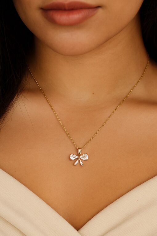 Collier en acier avec nœud baguette couleur or et chaîne SF - 3653
