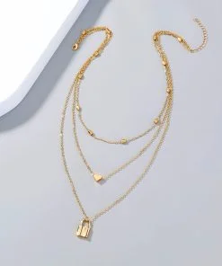 Collier superposé avec pendentif en forme de cœur et de cadenas couleur or en gros