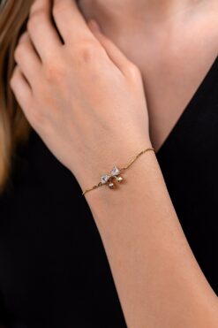 Bracelet en acier avec nœud couleur or et zircone, grande pierre, élévateur - 3627